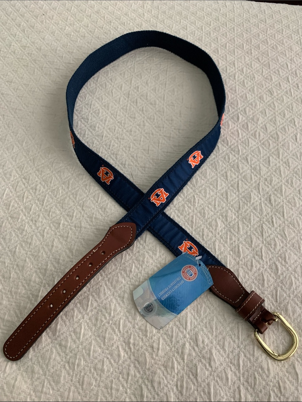 Navy Web Belt with Orange Logo Accents and Brown Leather Trim